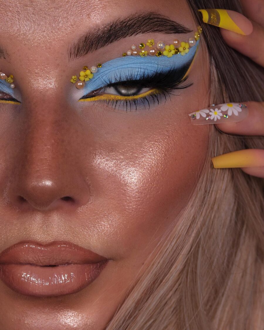 Vibrant baby blue and yellow floral makeup look