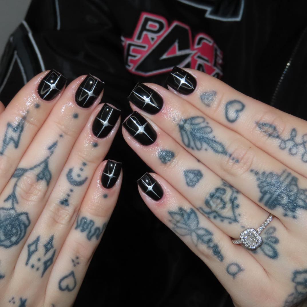 Chic Black Nails with Starry Accents
