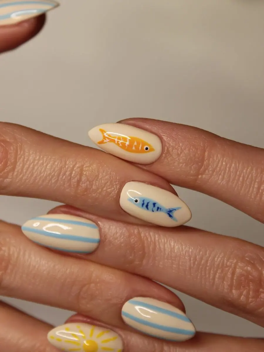Playful beach nails with vibrant fish accents