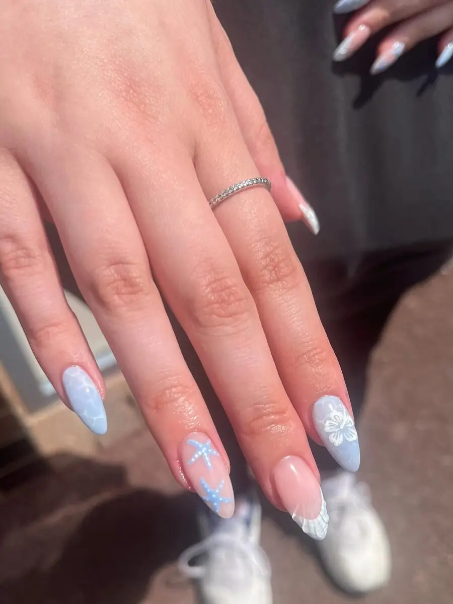 Charming blue beach-inspired nail art design