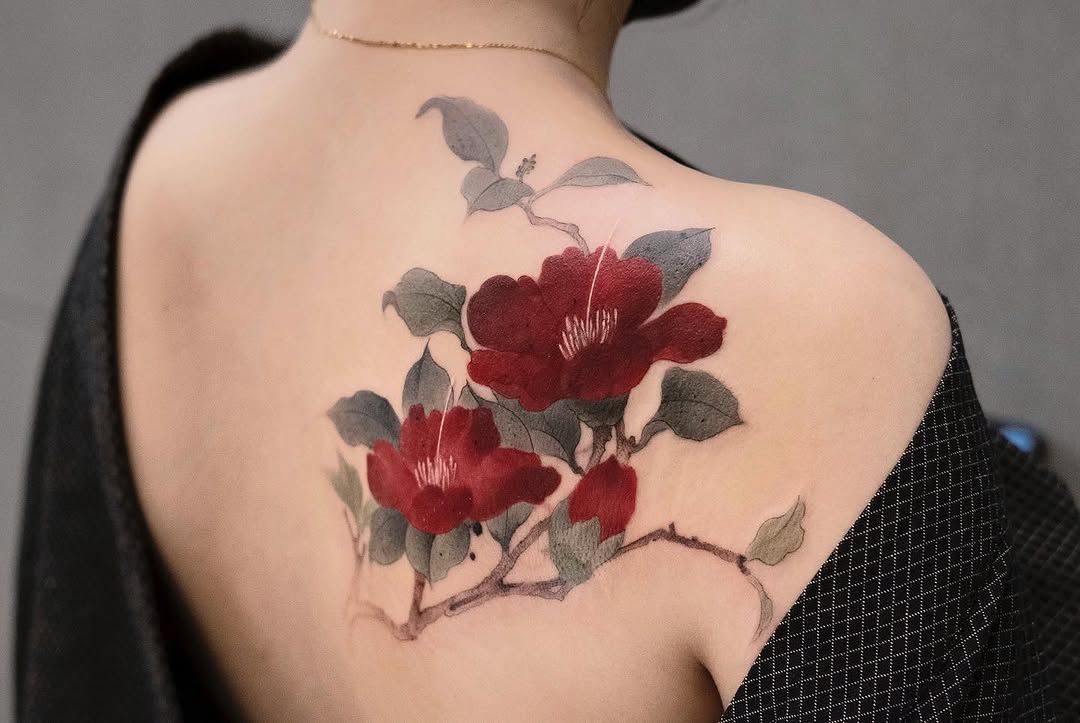 Stunning camellia tattoo on the back