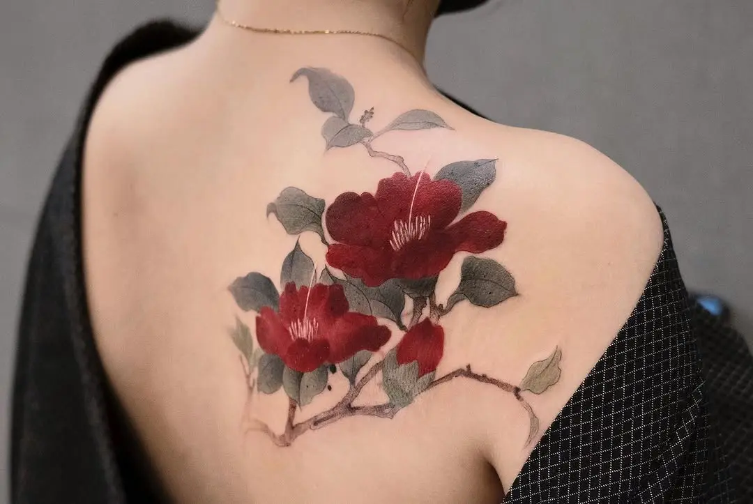 Stunning camellia tattoo on the back