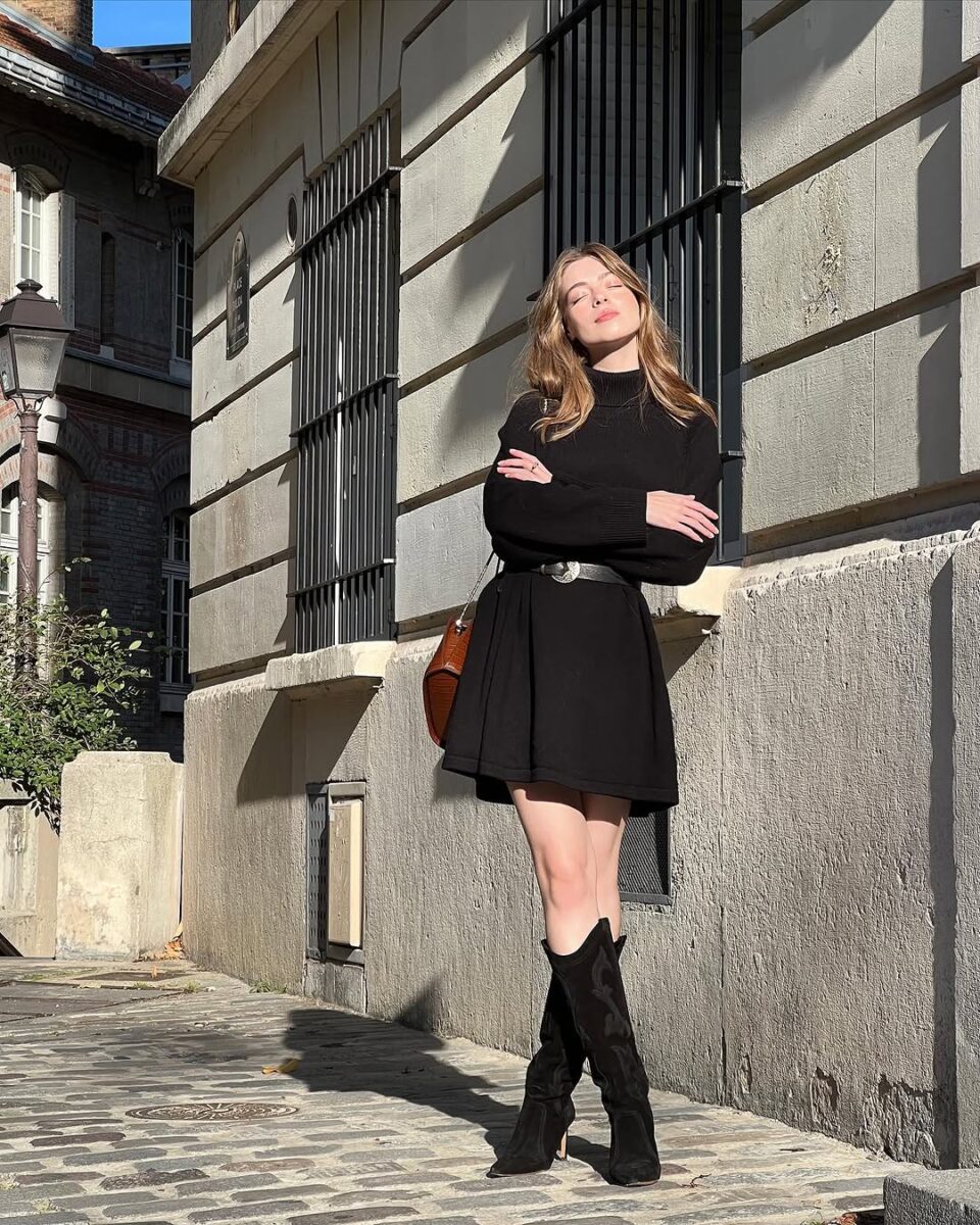 Stylish black dress with knee-high boots