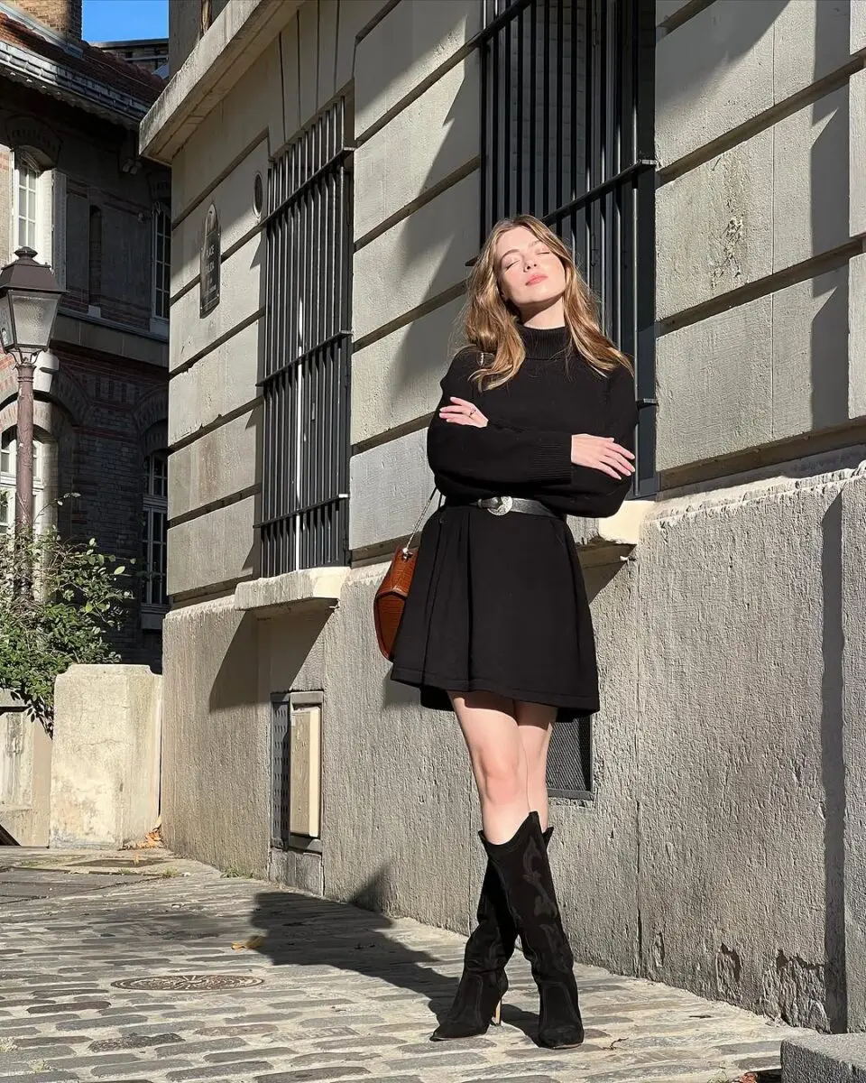 Stylish black dress with knee-high boots