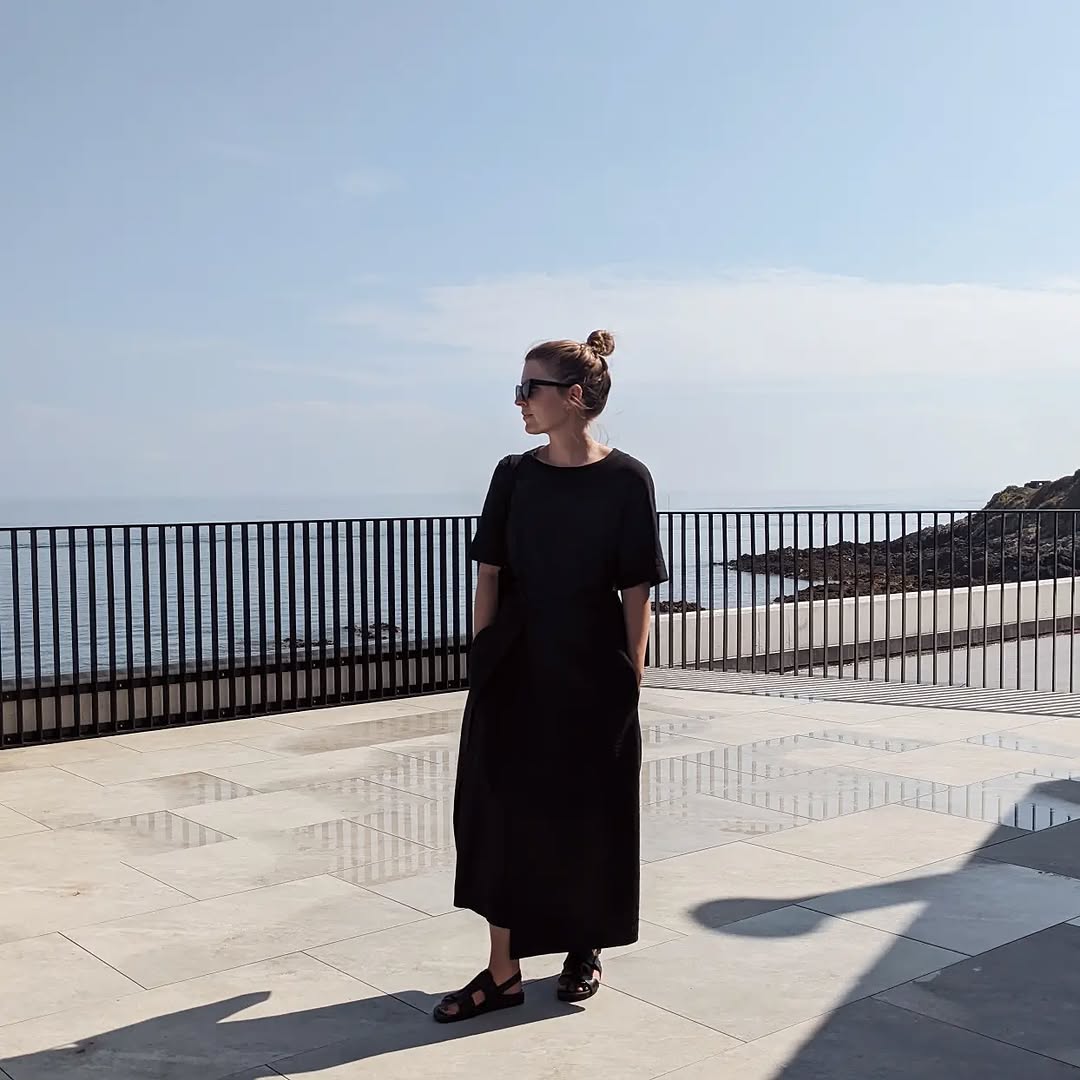 Stylish black dress by the seaside