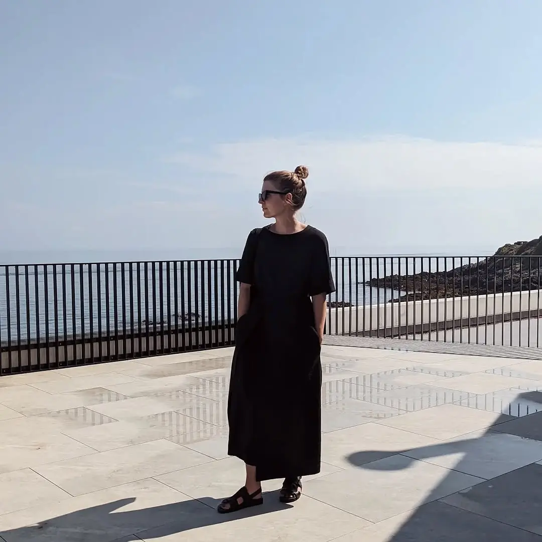 Stylish black dress by the seaside