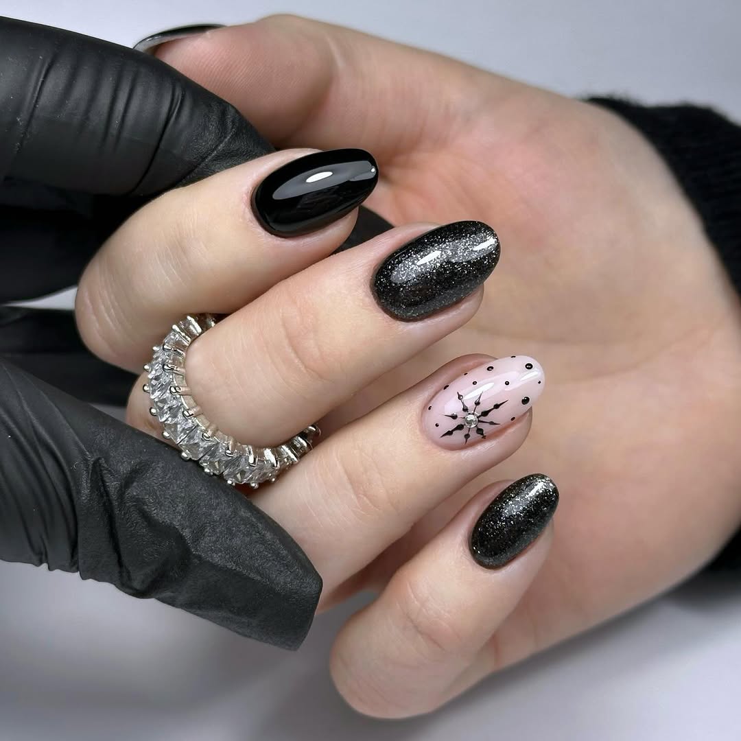 Elegant snowflake nails with black and silver accents