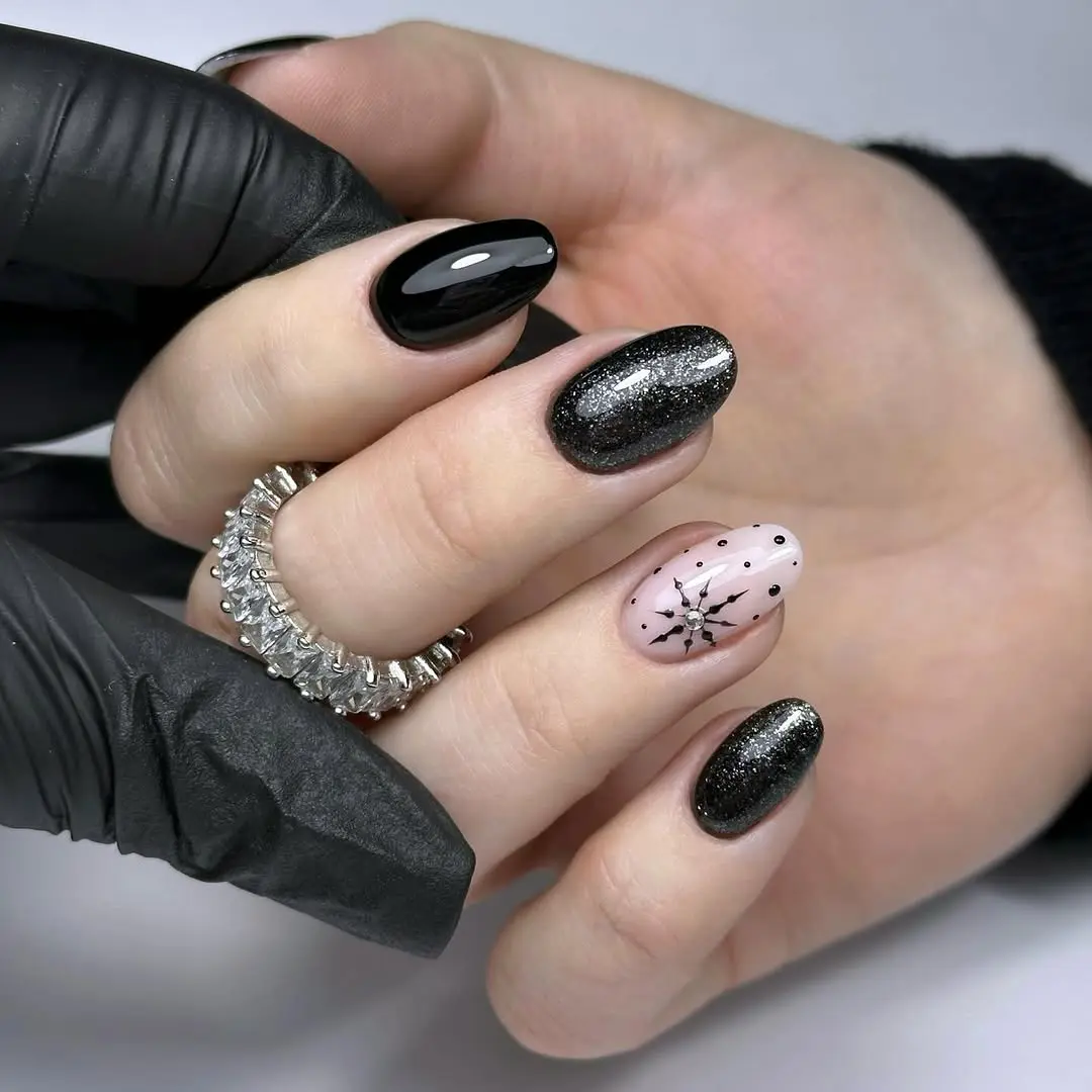 Elegant snowflake nails with black and silver accents