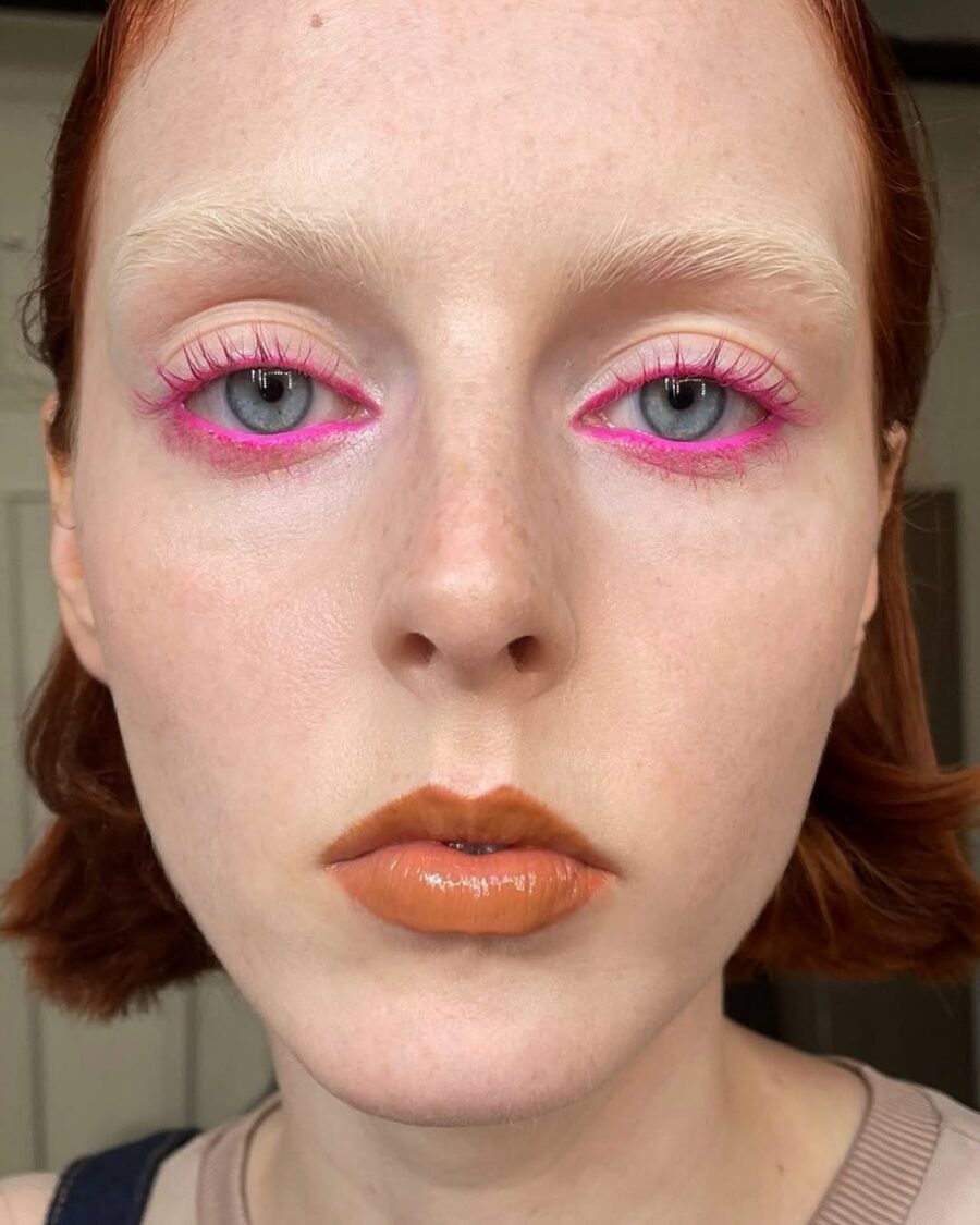 Vibrant neon pink eyeshadow with a bold flair