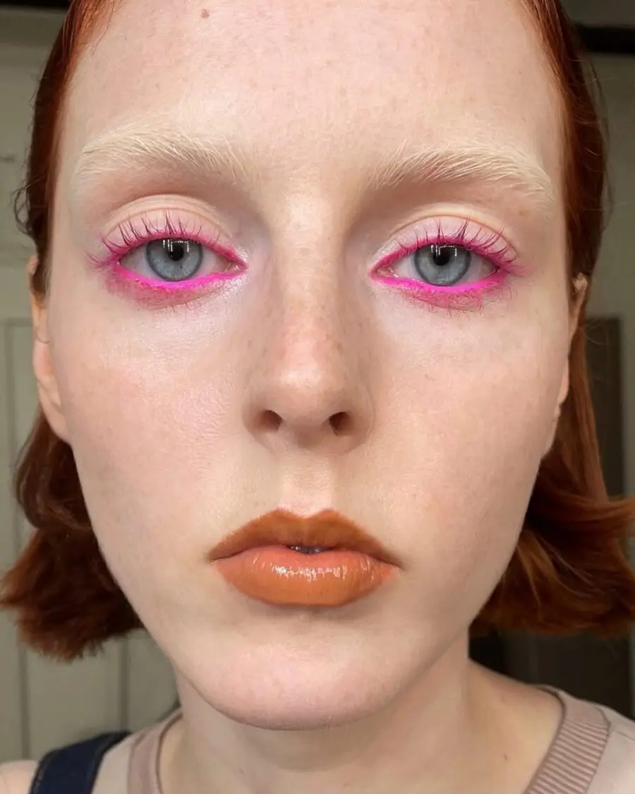 Vibrant neon pink eyeshadow with a bold flair