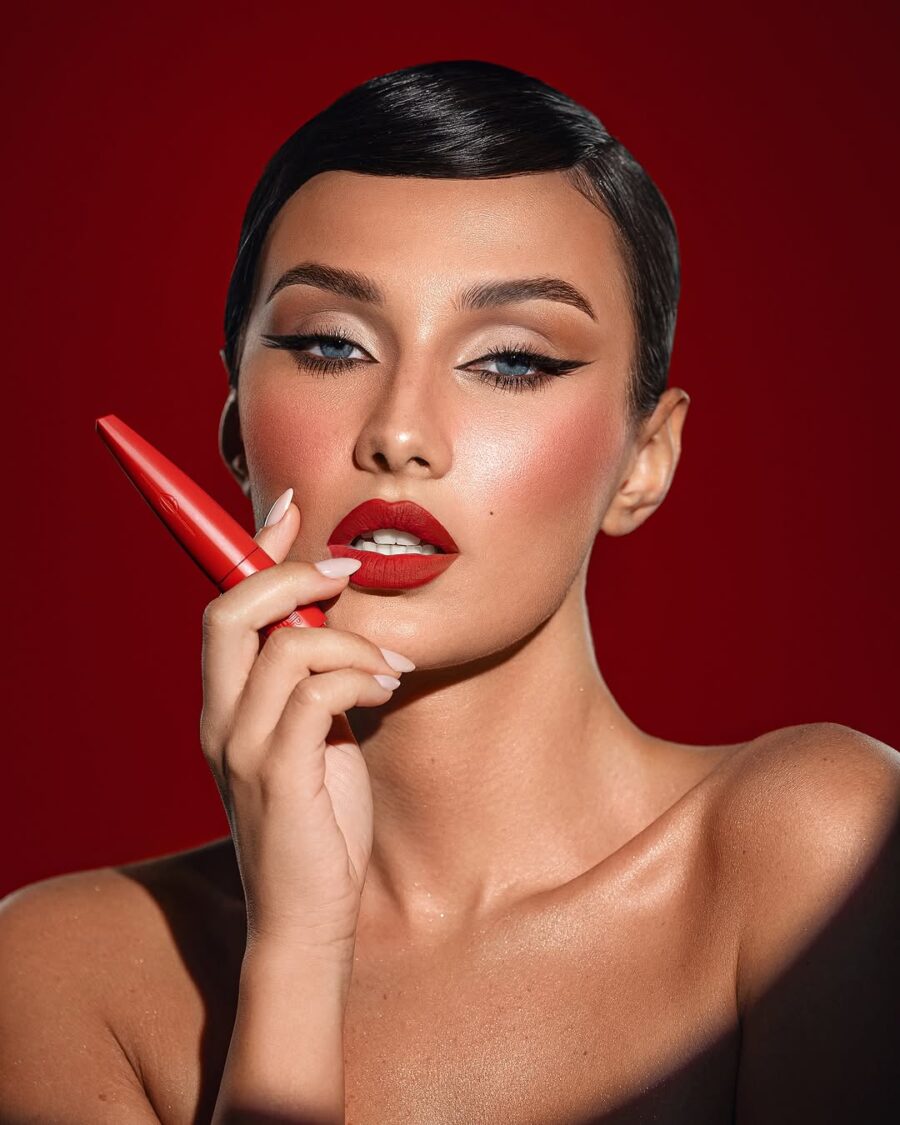 Bold red lips with striking cat eyeliner
