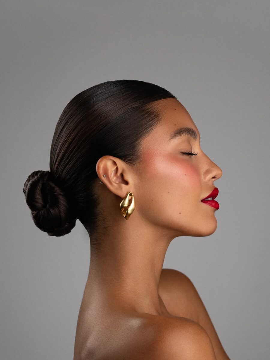Elegant red lipstick with sleek hair vibe