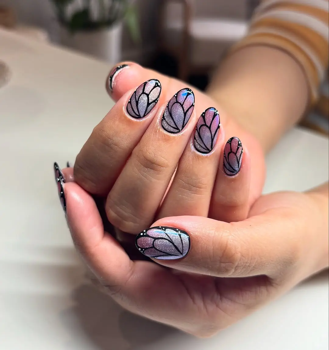 Gorgeous butterfly nail art with shimmering accents