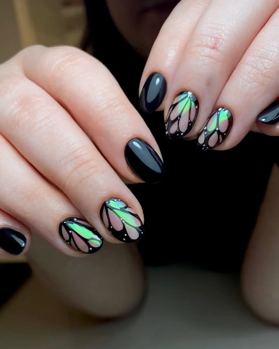Stylish black nails with iridescent butterfly design