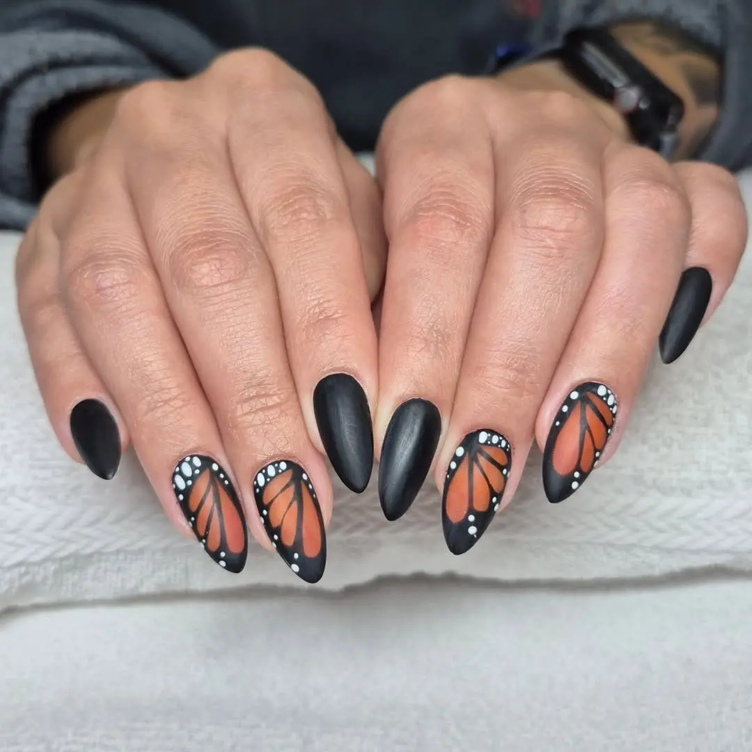 Chic butterfly nails with matte black accents