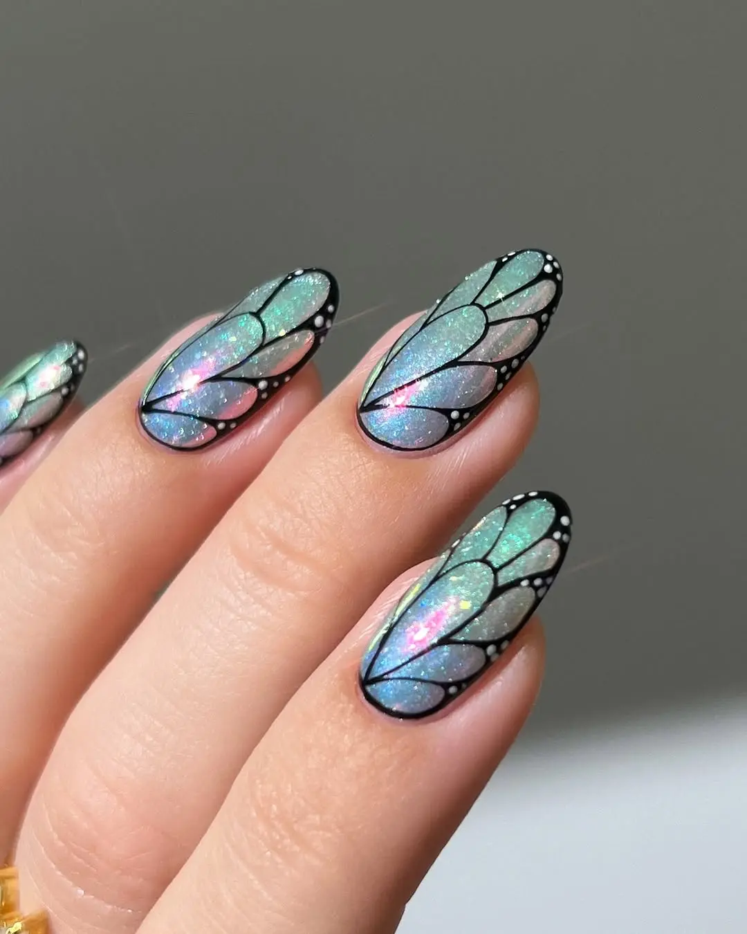 Stunning iridescent butterfly nail art design