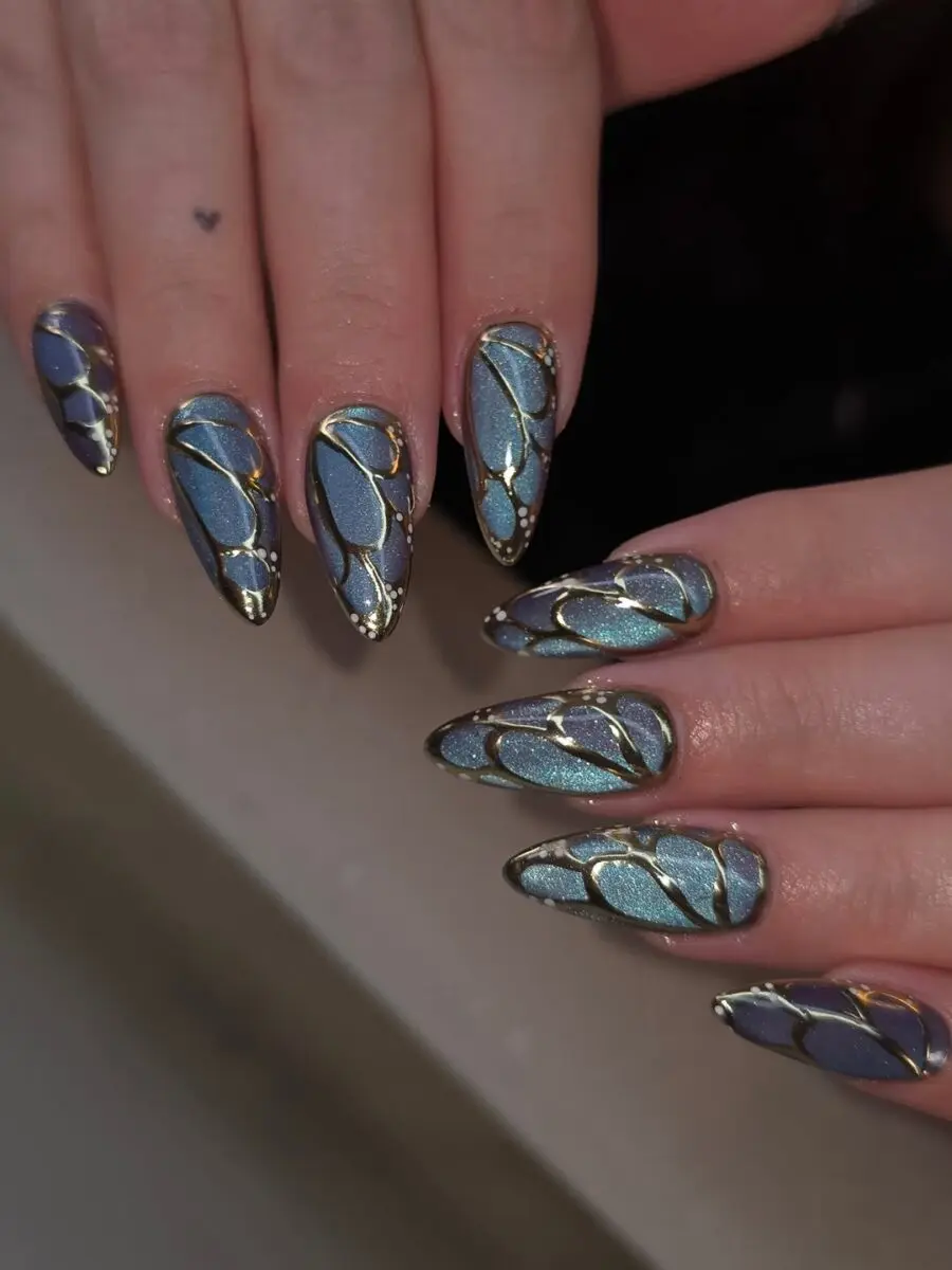 Stylish Butterfly-Inspired Blue and Gold Nails