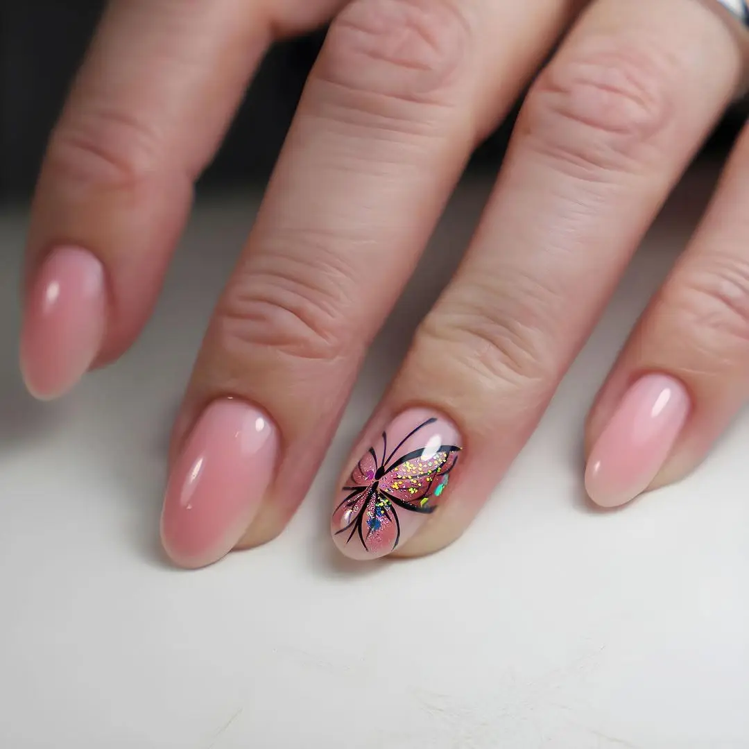 Elegant butterfly design on soft pink nails
