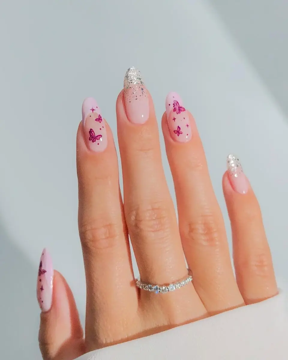 Charming pink butterfly nails with sparkling tips
