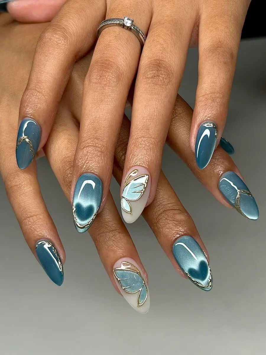 Elegant butterfly nails with golden accents