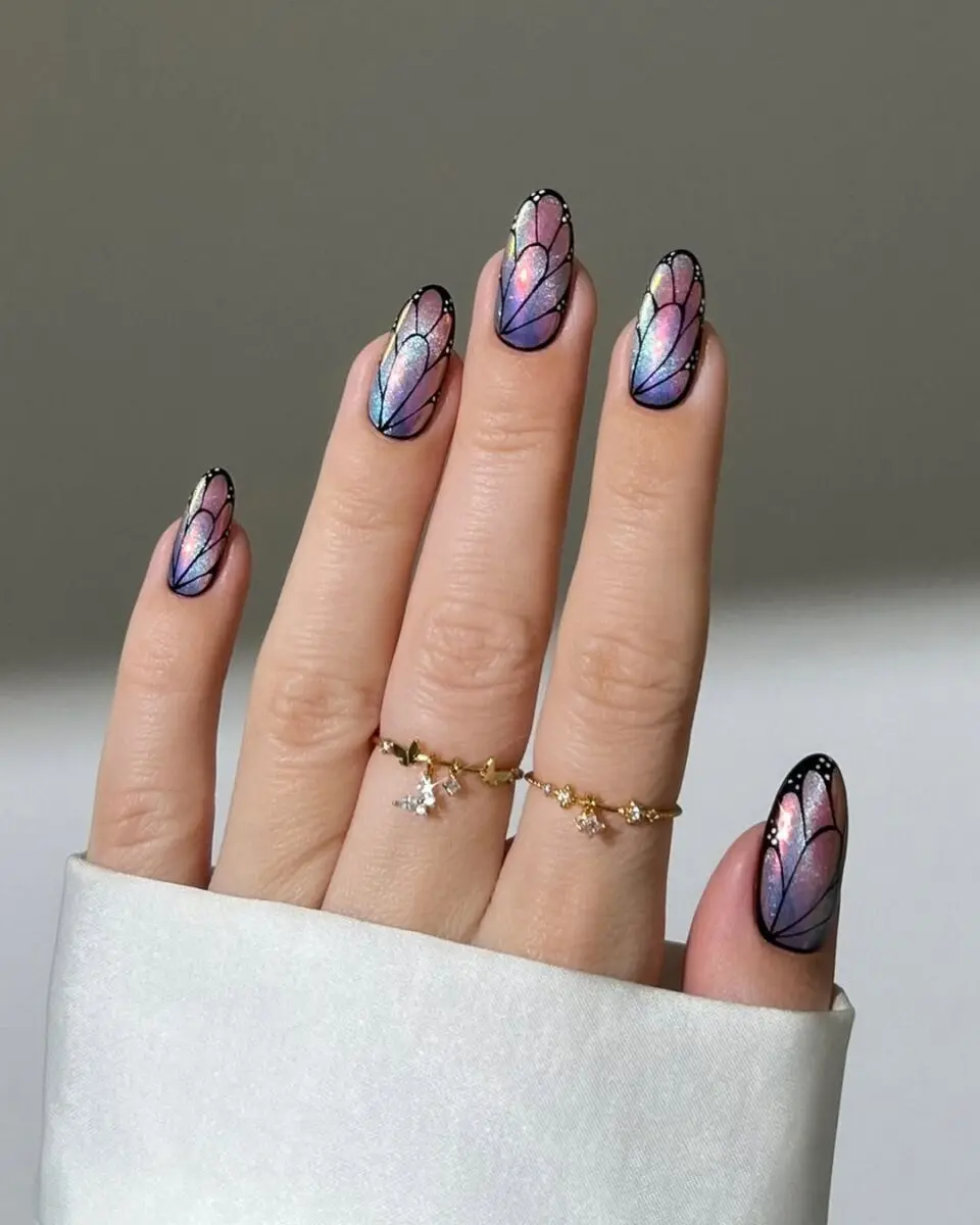 Stunning butterfly nail design with holographic sheen