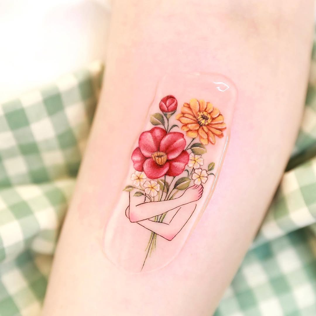 Colorful camellia tattoo with delicate details
