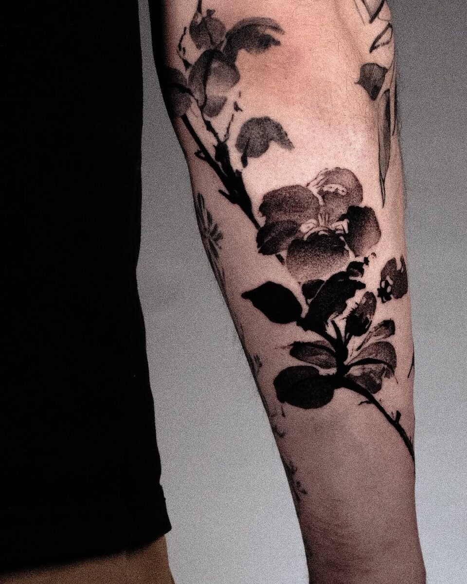 Stunning Camellia Tattoo in Bold Black Ink