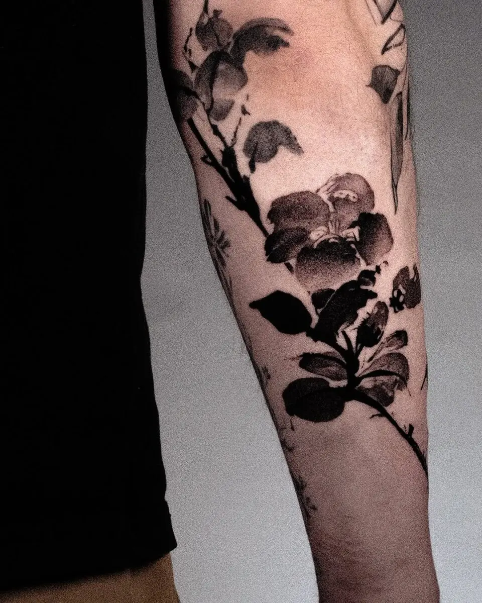 Stunning Camellia Tattoo in Bold Black Ink