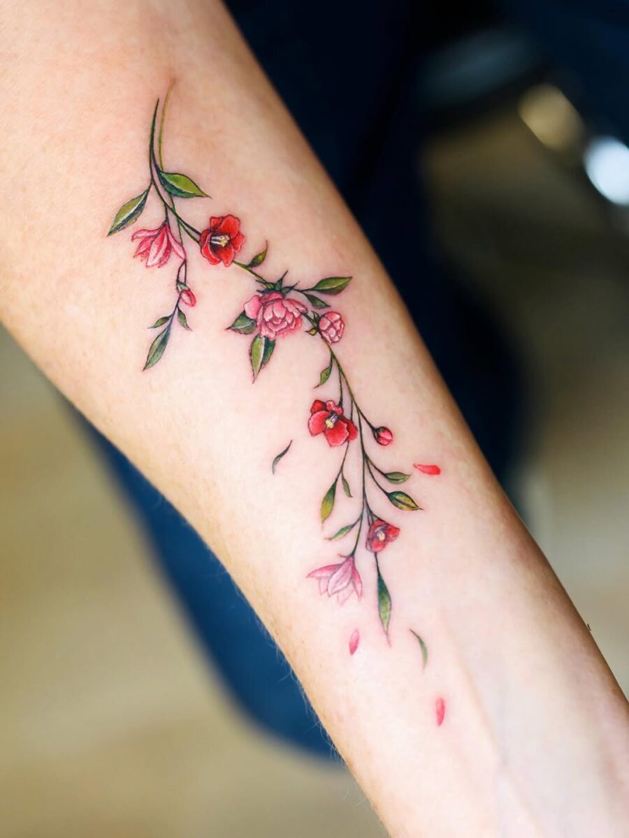 Delicate Camellia Tattoo on Forearm