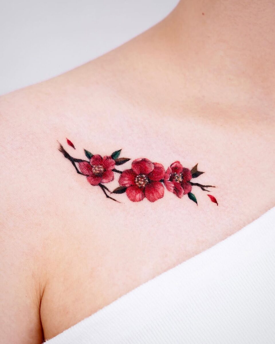 Delicate camellia tattoo on shoulder area