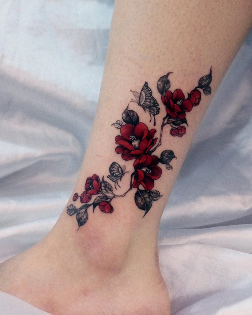Elegant camellia tattoo with butterflies design