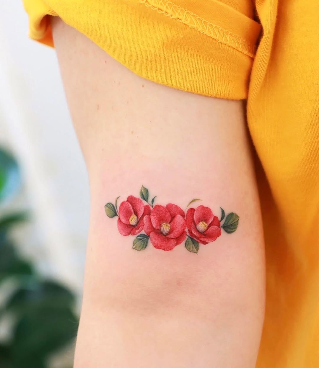 Vibrant Camellia Tattoo: A Colorful Floral Design