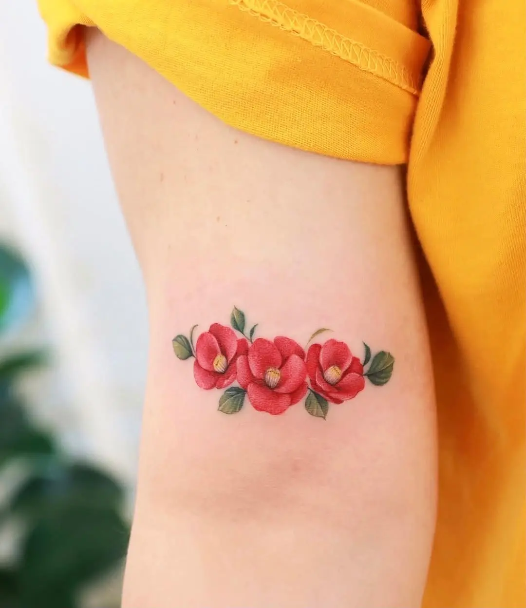 Vibrant Camellia Tattoo: A Colorful Floral Design