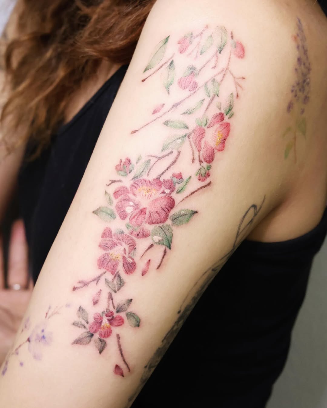 Elegant camellia tattoo showcasing intricate blooms