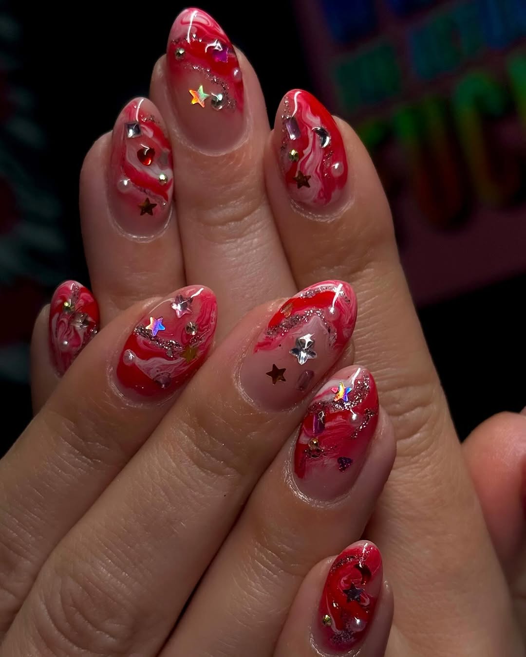 Stylish candy cane nails with sparkling accents