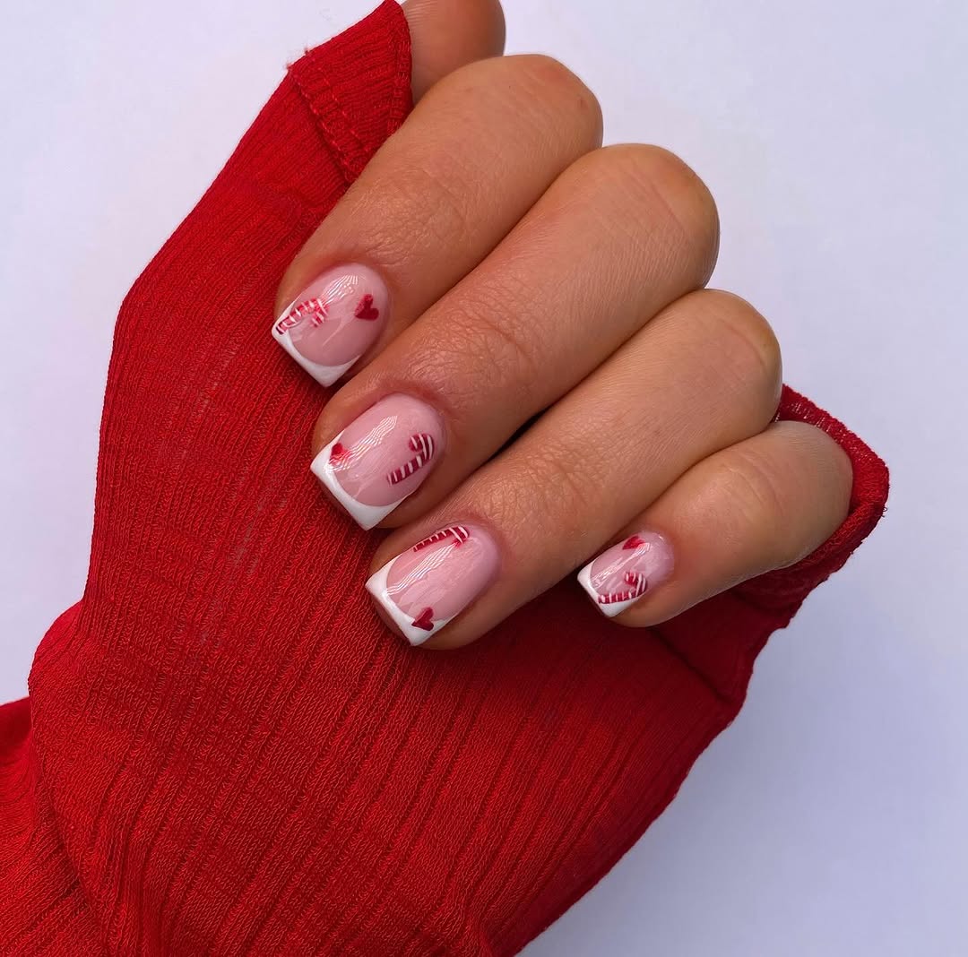 Festive candy cane nail design for the holidays.