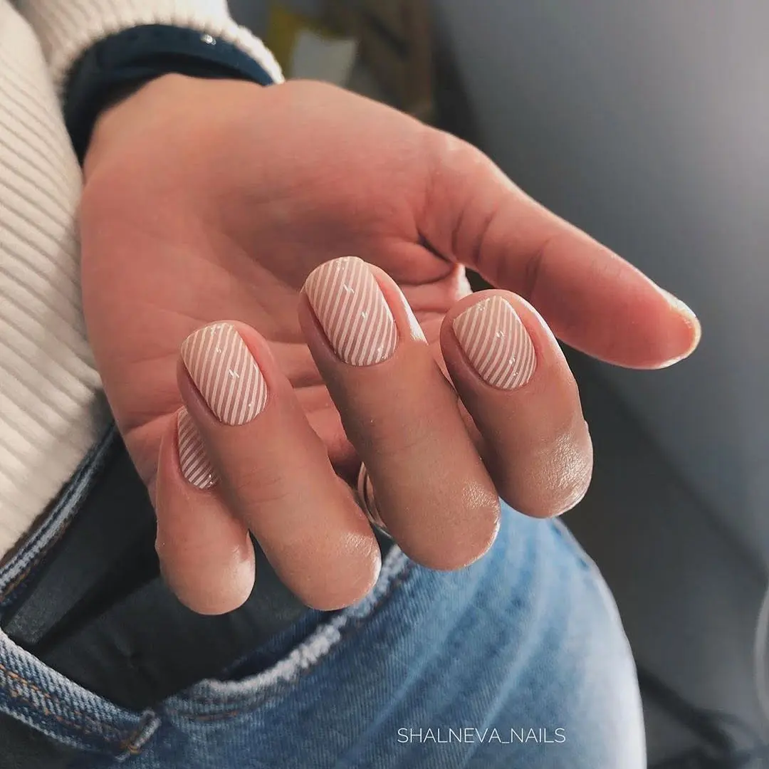 Chic candy cane nail design with white stripes
