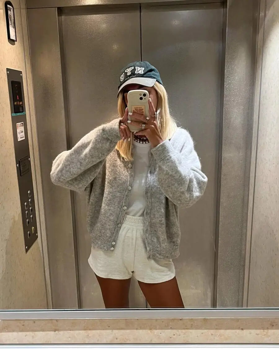 Effortless summer style captured in an elevator.