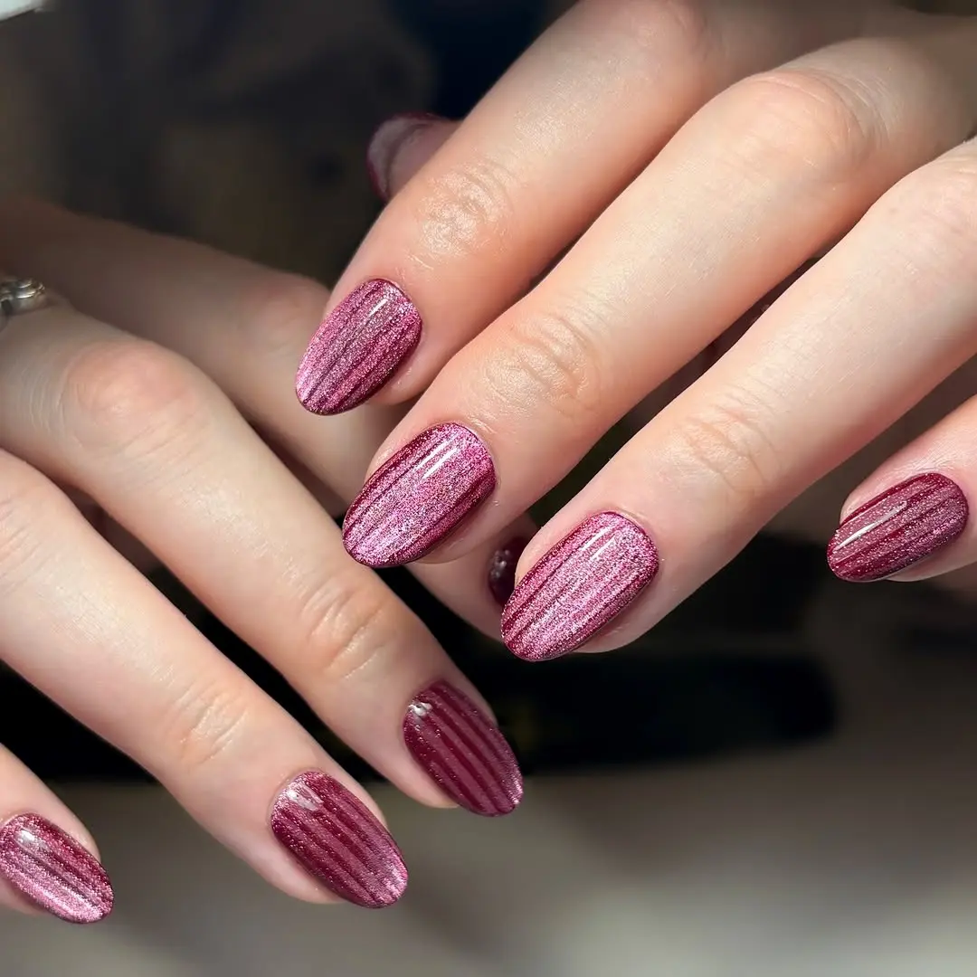 Stunning cat eye nails with striking pink stripes