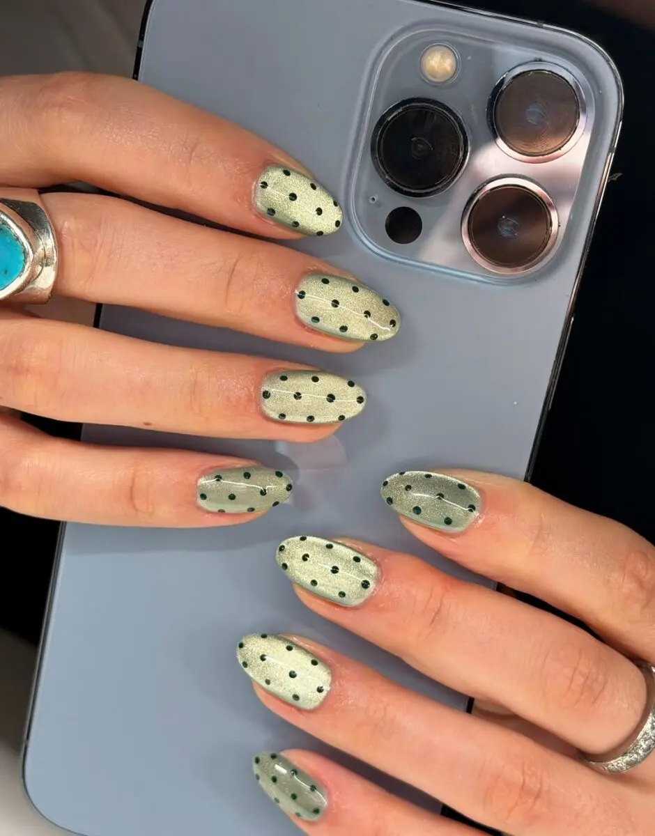Chic pale green cat eye polka dot nails