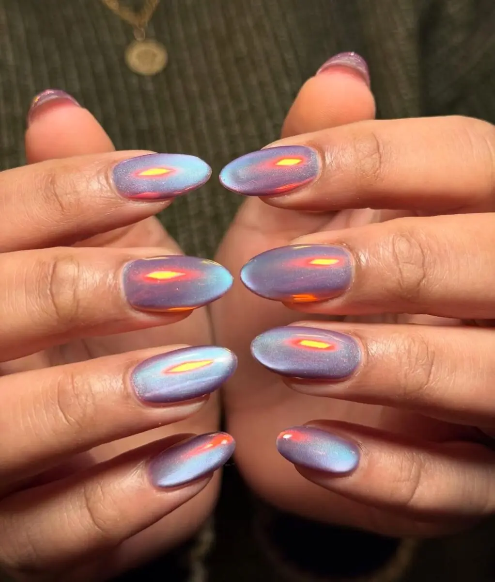 Mesmerizing blue cat eye nails with shimmer