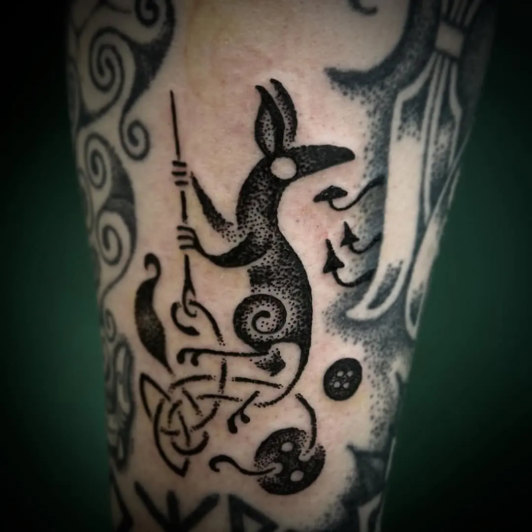 Whimsical Celtic fox tattoo with intricate designs
