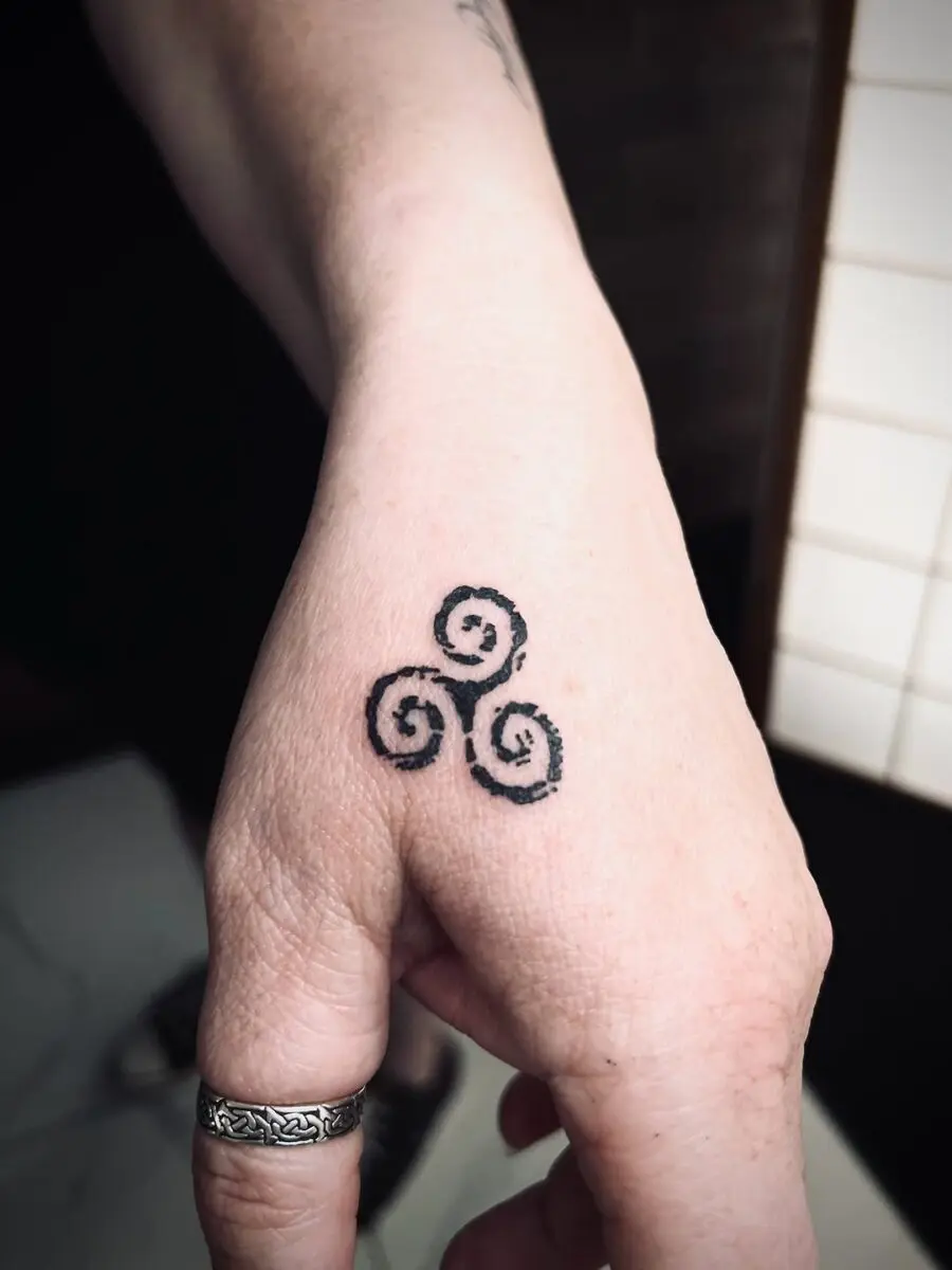 Elegant Celtic swirl tattoo on the hand