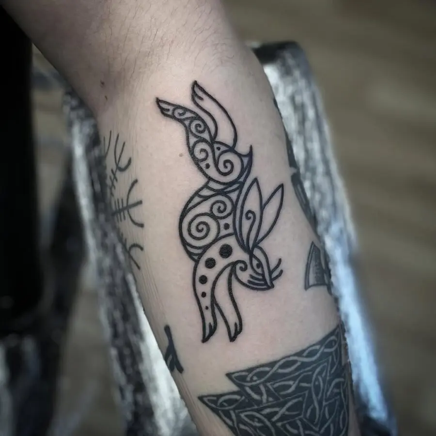 Elegant Celtic bird tattoo with intricate patterns
