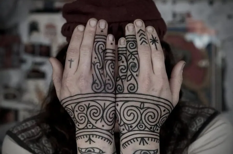 Intricate Celtic designs on hands and wrists