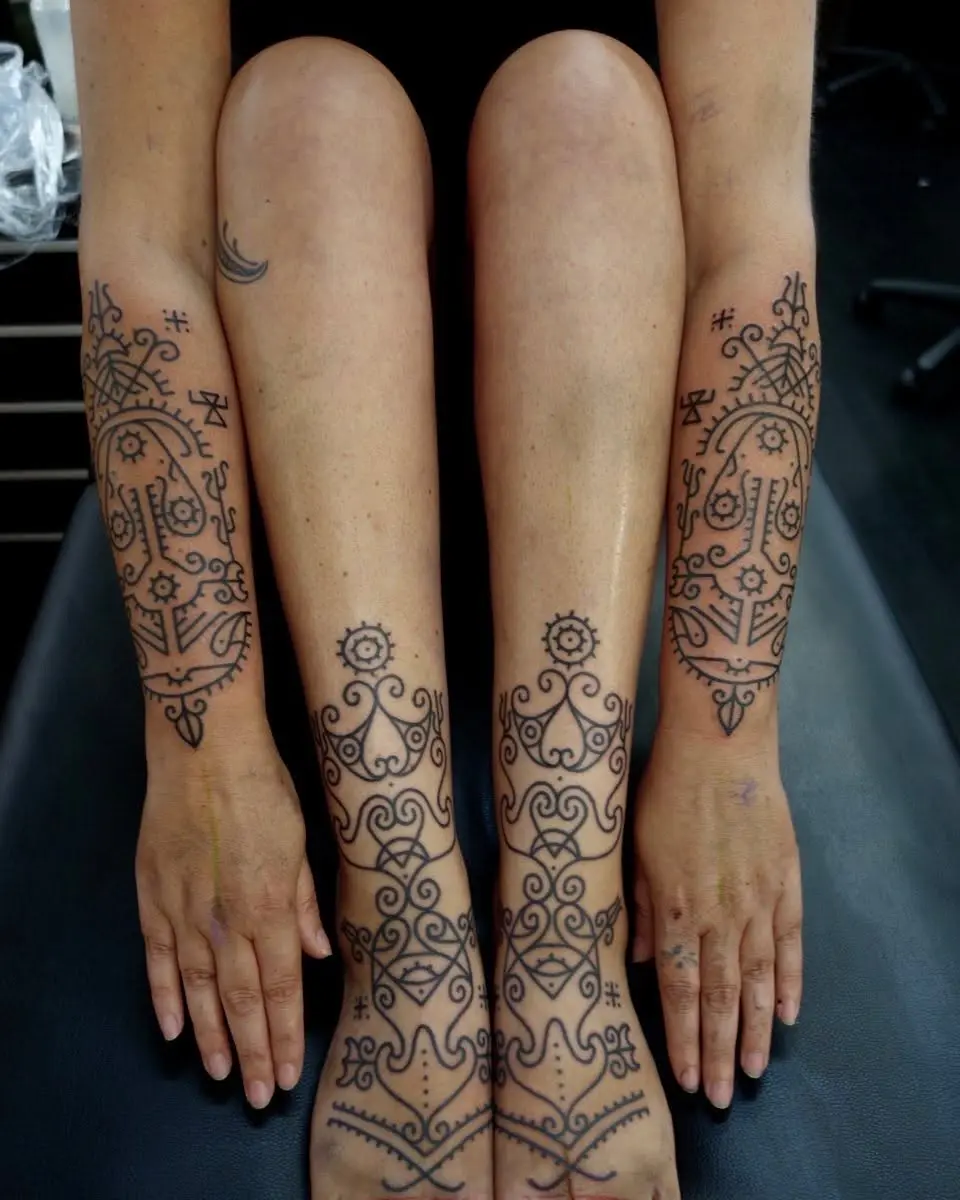 Intricate Celtic tattoo designs on limbs
