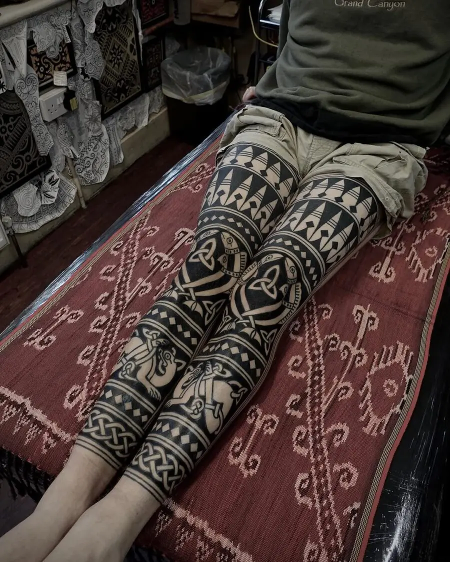Intricate Celtic leg sleeve tattoo design