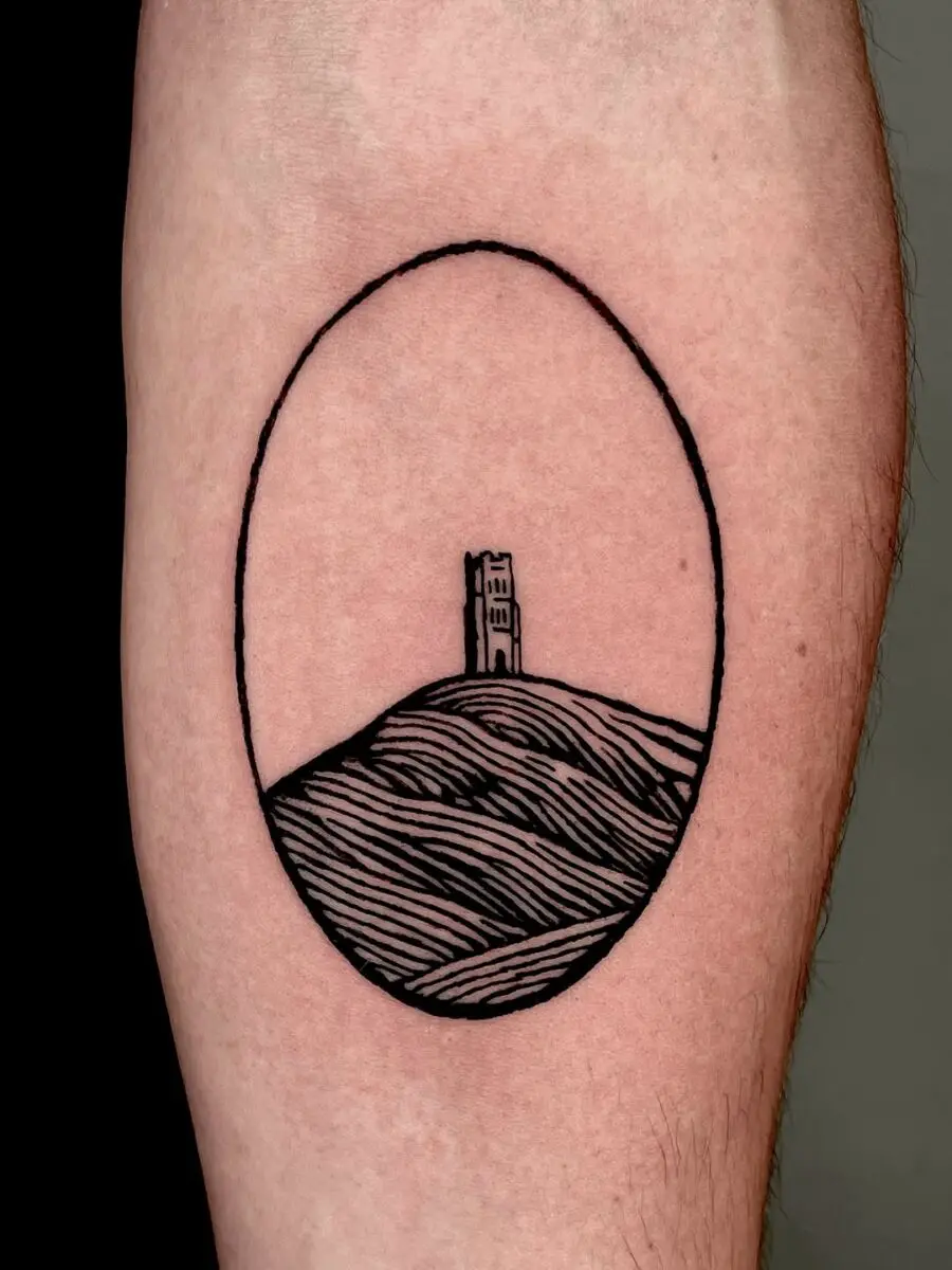 Minimalist Celtic tower tattoo capturing heritage