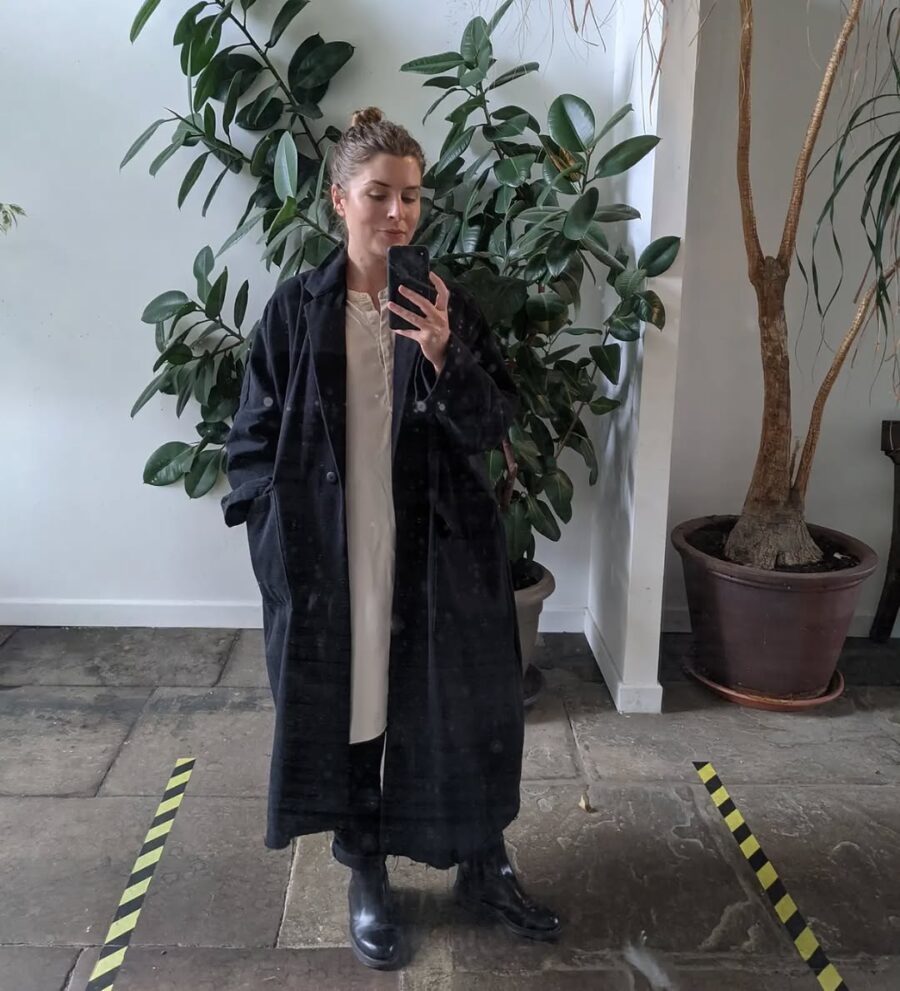Chic black coat with stylish Chelsea boots