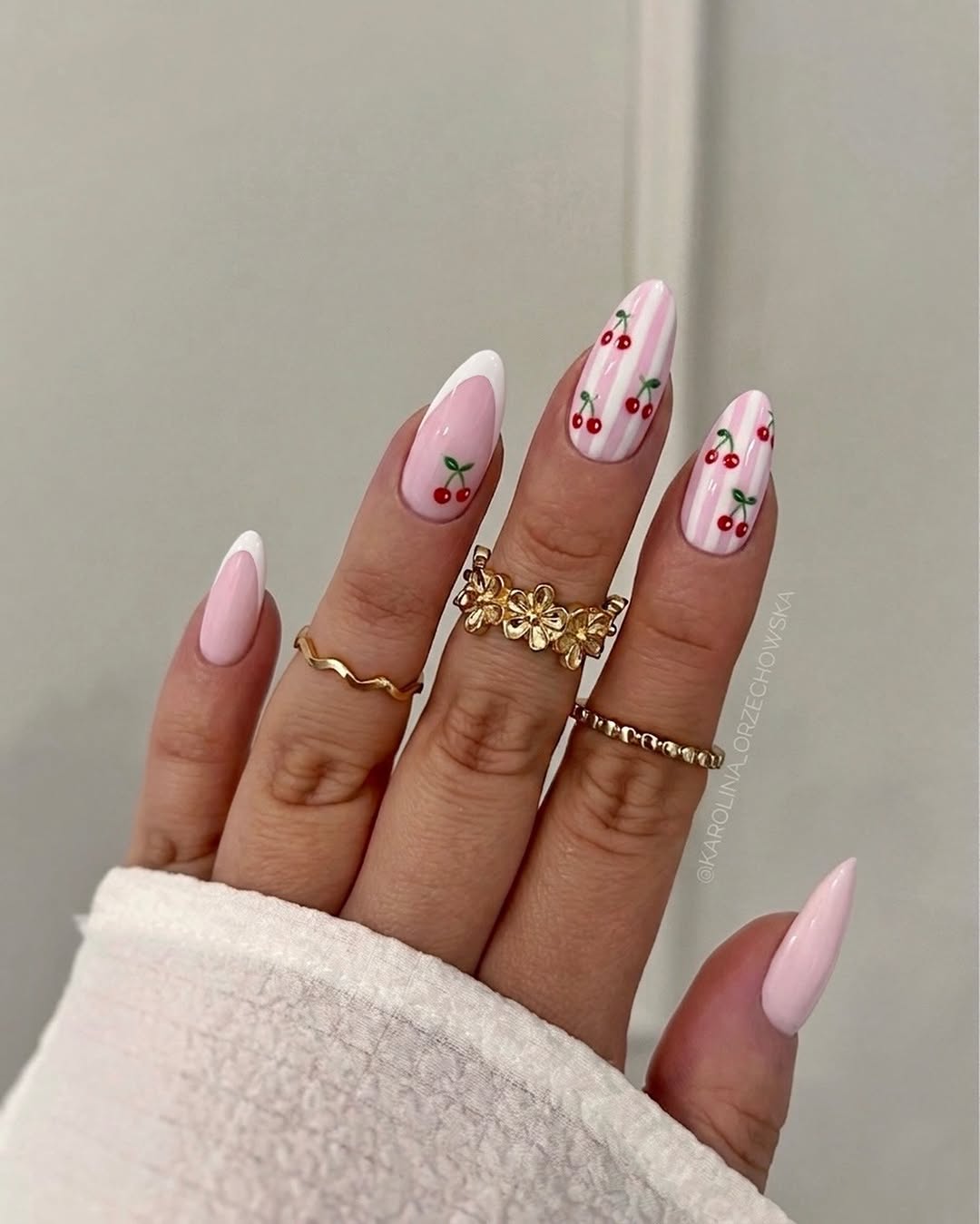 Charming cherry nail art with a pastel twist